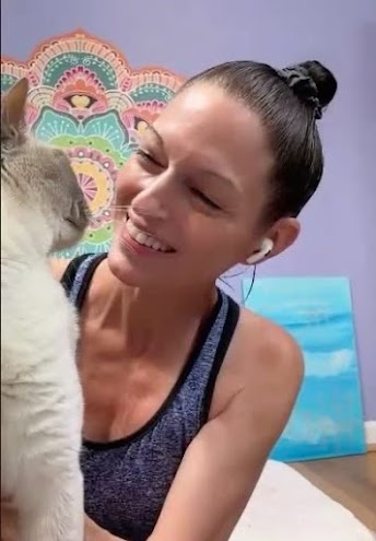 Michelle Blake smiling with her cat